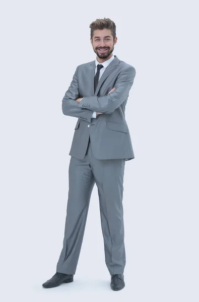 Volledige lengte van een jonge Kaukasische zakenman met armen gevouwen — Stockfoto