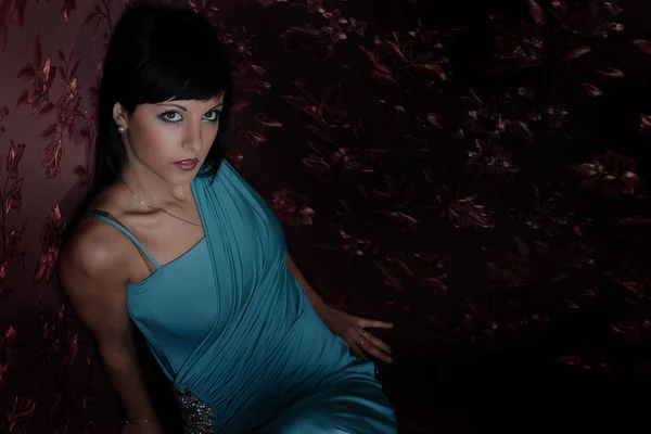 Girl in a beautiful dress posing in studio — Stock Photo, Image