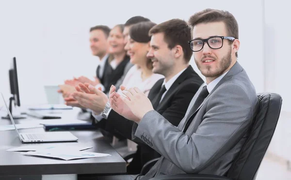 Cheering business team sitting at Desk — Stock Photo, Image