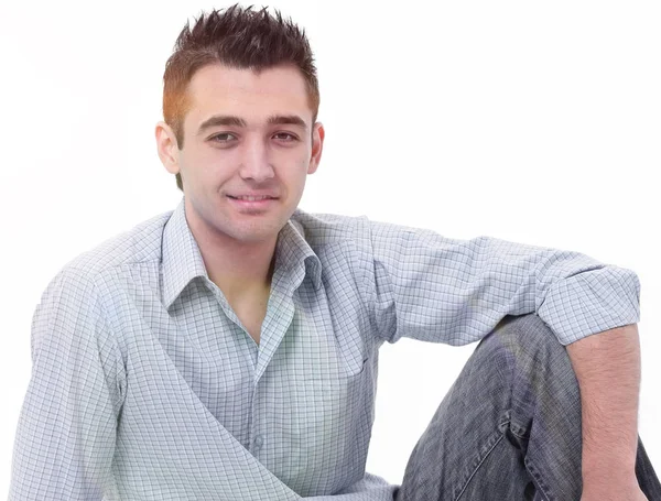 Modern young man sitting on the floor — Stock Photo, Image