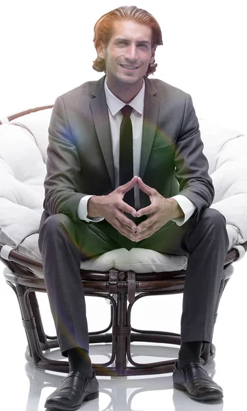 Businessman sitting in a comfortable big chair — Stock Photo, Image