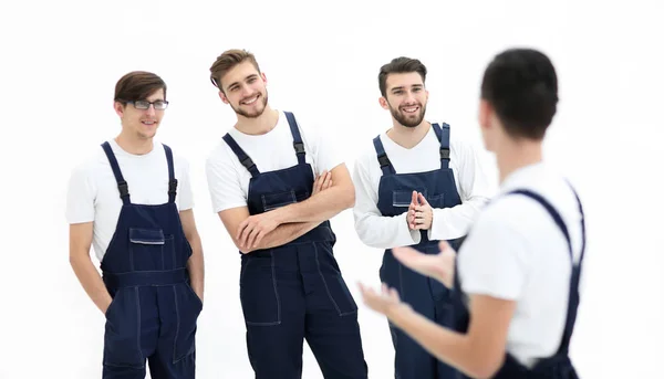 Cheerful team of responsible movers and their smiling leader. — Stock Photo, Image