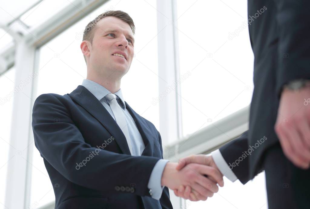 handshake of business partners after a favorable trade deal