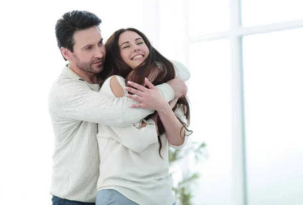 Portrait of a couple in love sitting near the window. — Stock Photo, Image