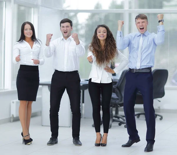 Portrait of a triumphant business team — Stock Photo, Image