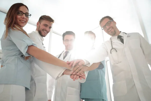 Doctors and nurses coordinate hands — Stock Photo, Image