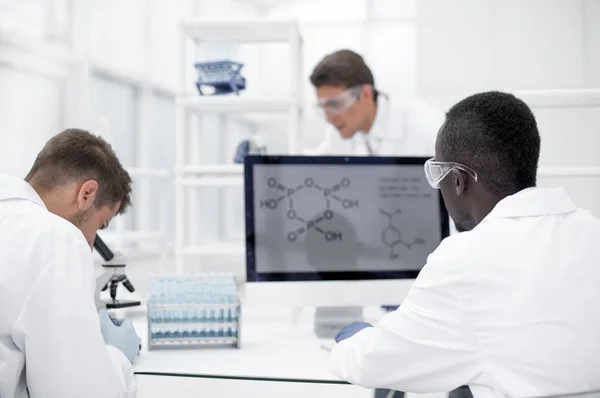 Group of scientists in a modern laboratory — Stock Photo, Image