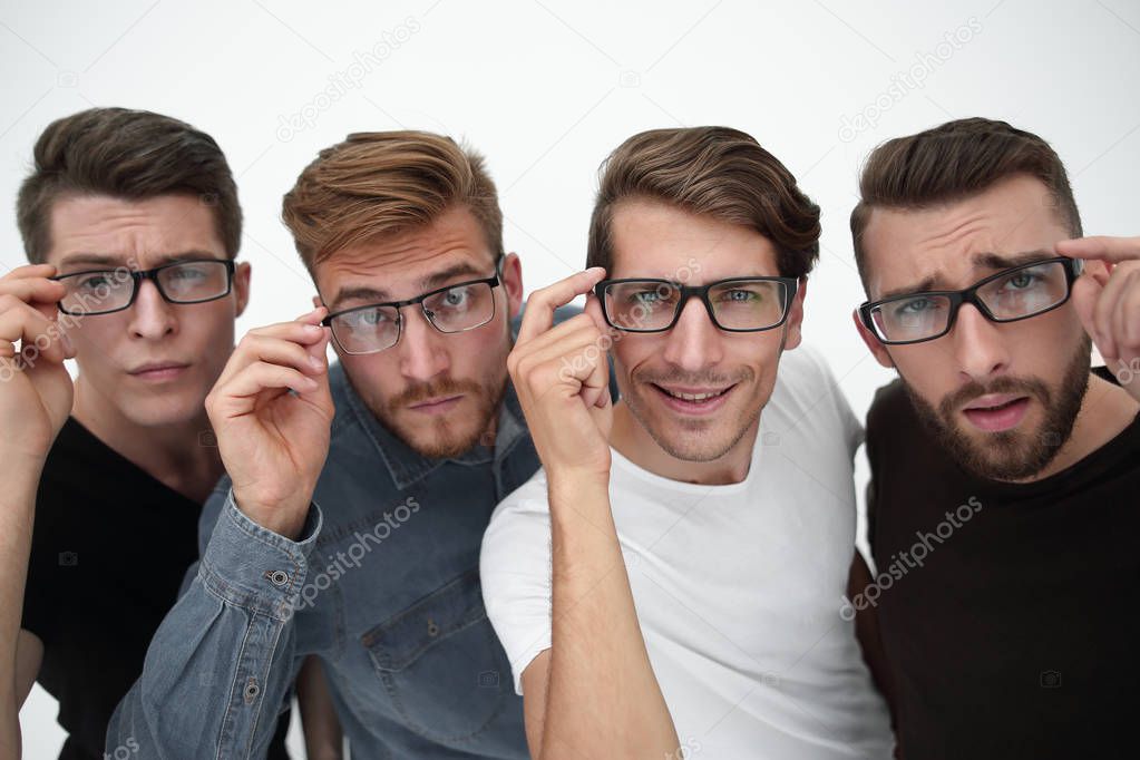 Close up of four happy colleagues working in glasses