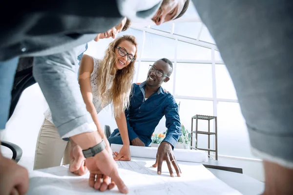 Close up.a group of young architects are working with new sketches — Stock Photo, Image