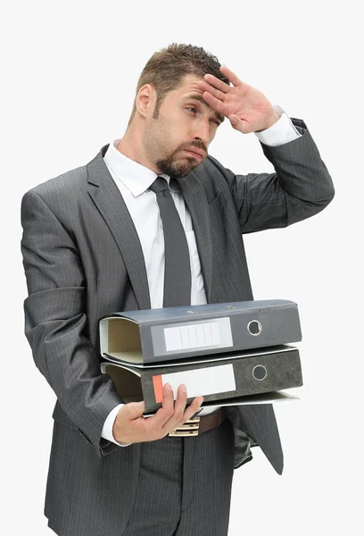 Serious businessman holds a lot of folders with documents. — Stock Photo, Image