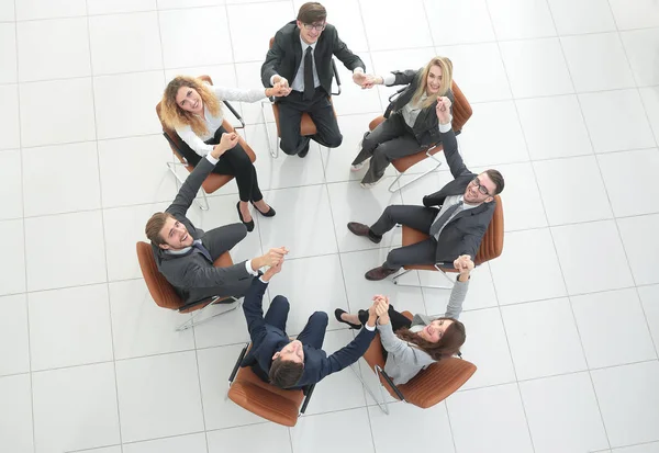 Business-team som håller varandras händer. — Stockfoto