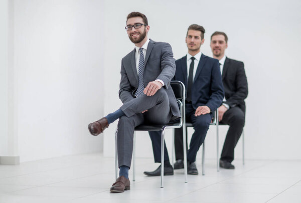 group of serious business people waiting for the interview