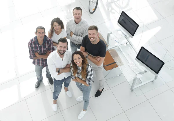 Group of creative professionals standing in office — Stock Photo, Image