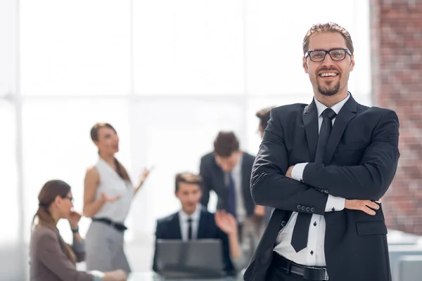 Successful businessman on the background of the office — Stock Photo, Image