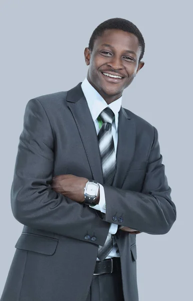 Zdjęcie uśmiechający się afrykańskiego człowieka ubranego w garnitur, stojąc na białym tle Obraz Stockowy