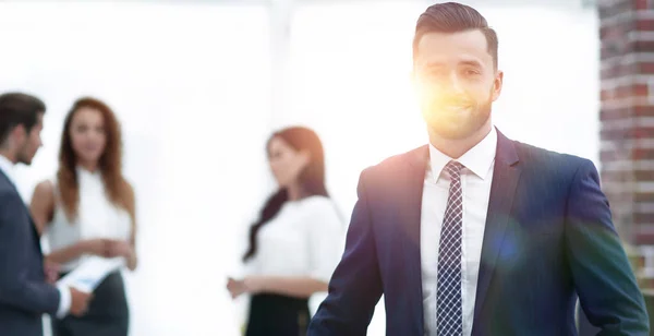 Businessman on the background of the workplace — Stock Photo, Image