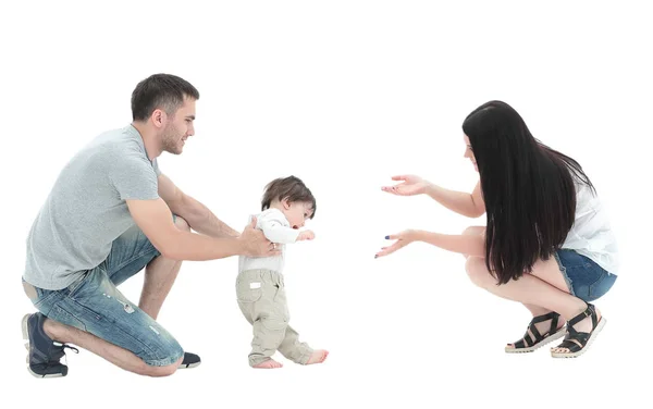 Little boy making  first steps with the help of parents — Stock Photo, Image