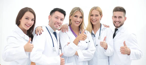 Professionella medicinska team visar tummen — Stockfoto