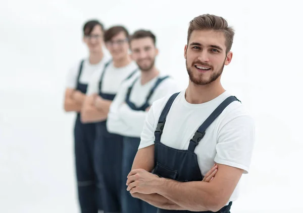 Vrolijk team van verantwoordelijke verhuizers geïsoleerd op witte achtergrond — Stockfoto