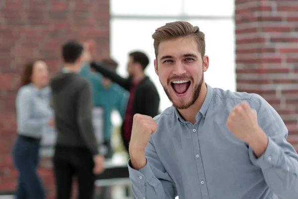 Handsome  businessman celebrating victory shouting happily in th — Stock Photo, Image