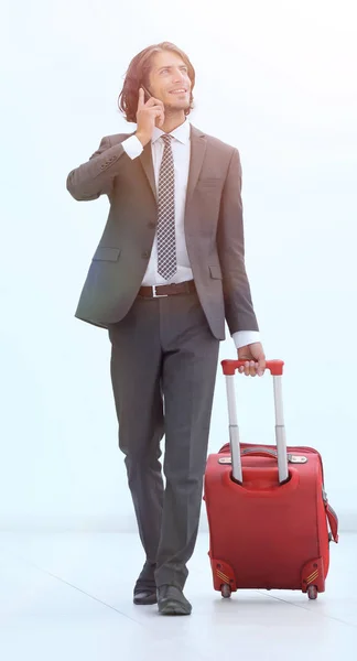Successful businessman with travel suitcase — Stock Photo, Image