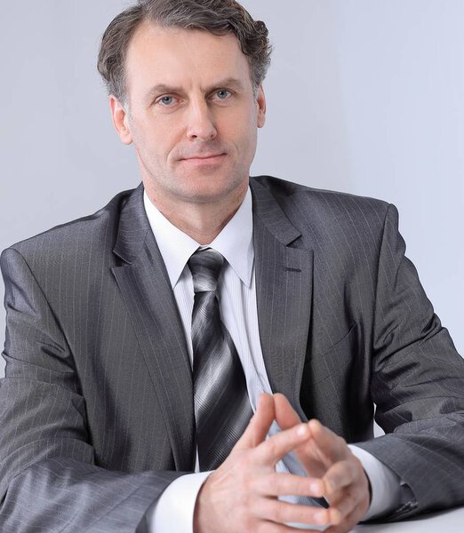 Portrait of businessman sitting at the desk