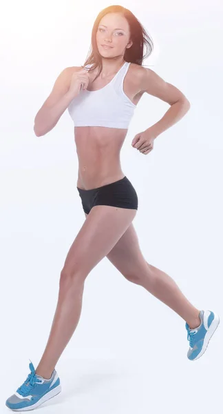 Mulher atraente envolvida em exercício aeróbico — Fotografia de Stock