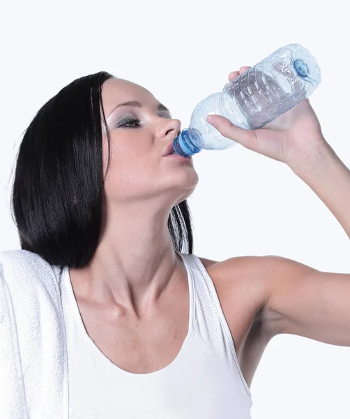 Sporting girl drinking water during exercise — Stock Photo, Image