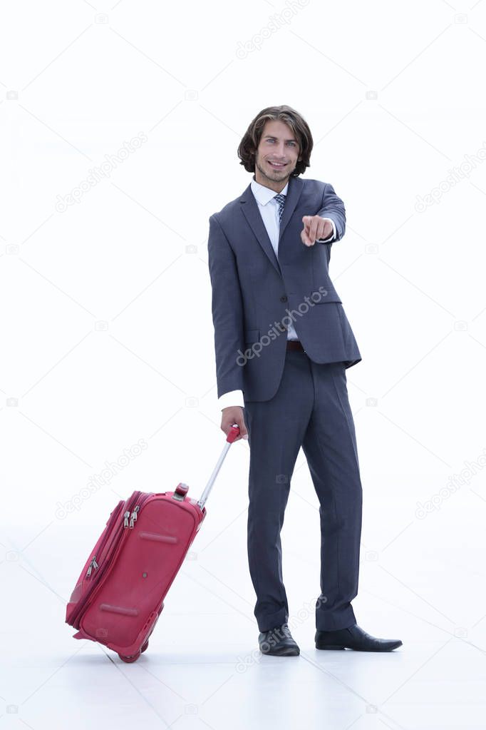 businessman with travel suitcase pointing forward