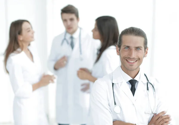 Smiling doctor therapist on blurred background. — Stock Photo, Image
