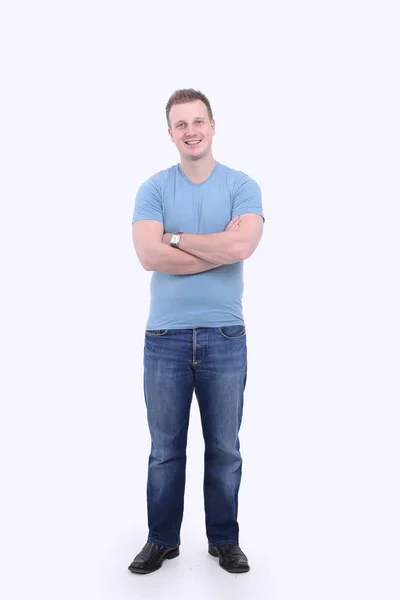 Full-size portrait.the kerel in jeans en een t-shirt. — Stockfoto