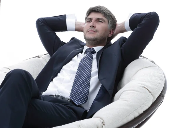 Portrait of a successful businessman sitting in a soft comfortable chair — Stock Photo, Image