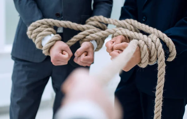 Close up.businessman pulls a business team on a rope — Stock Photo, Image