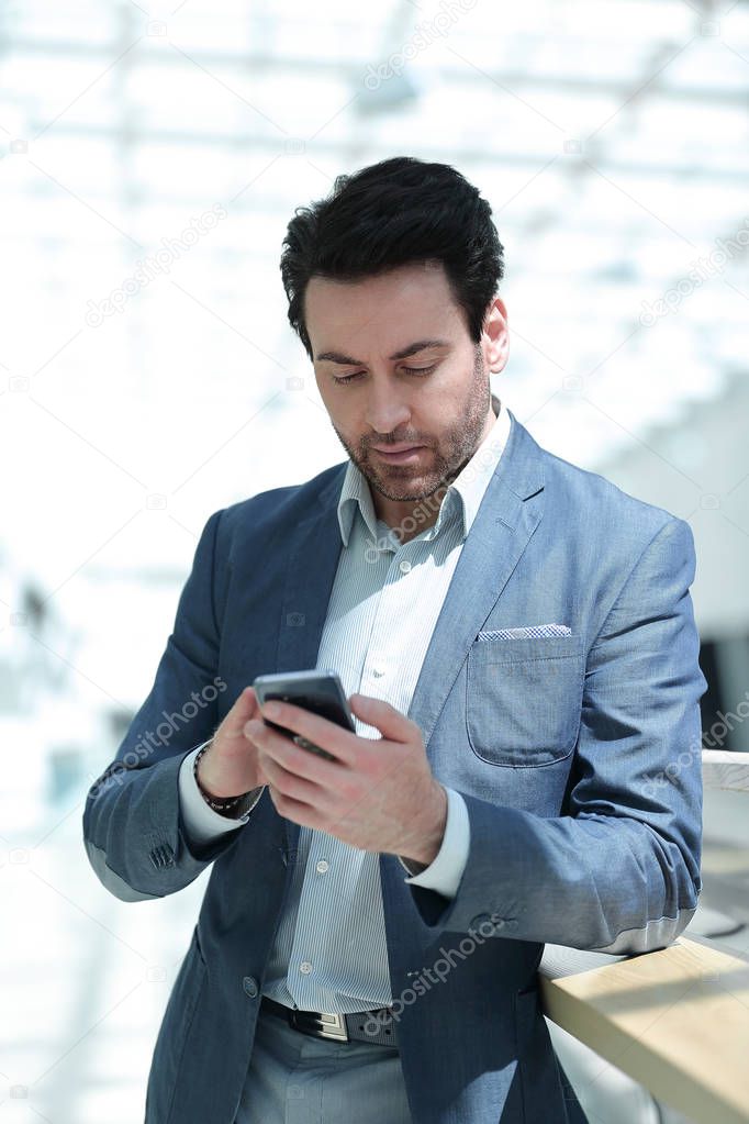 close up.businessman looking at the smartphone screen