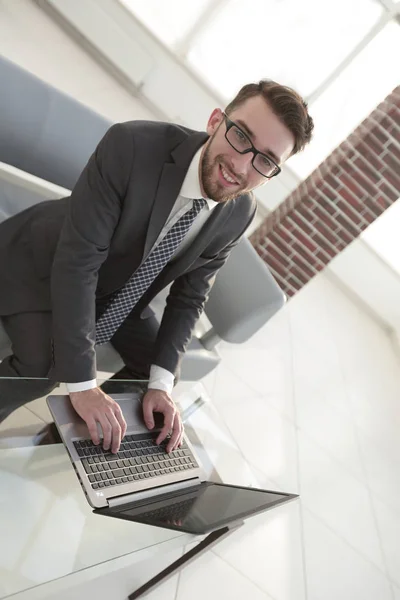 Concentrated professional IT developer with laptop — Stock Photo, Image