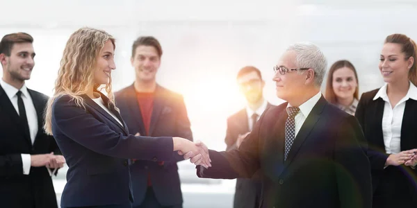 Handshake serious businessman and business woman — Stock Photo, Image