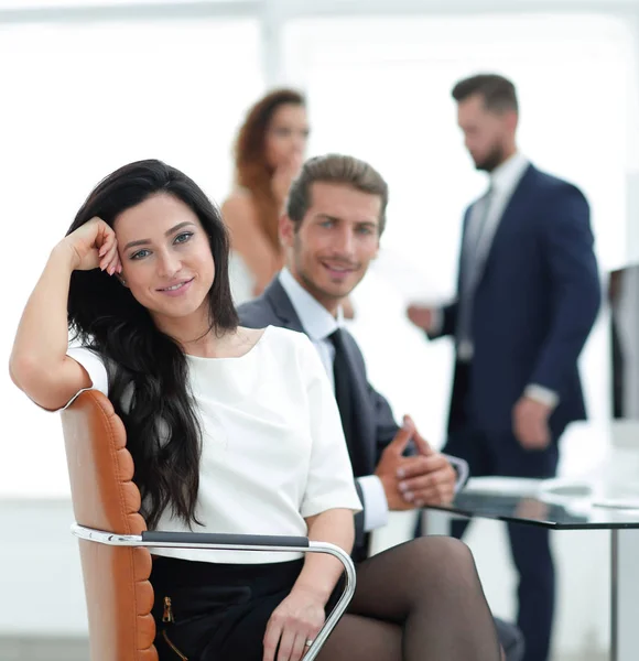 Young business woman and her colleagues — Stock Photo, Image