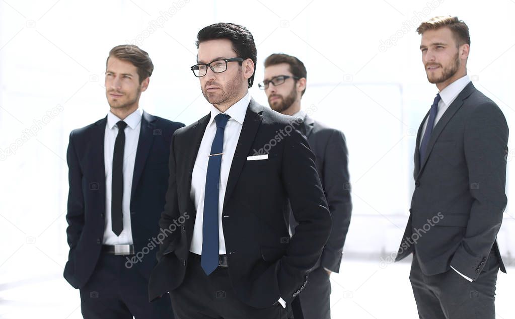 businessman and his business team standing in the office
