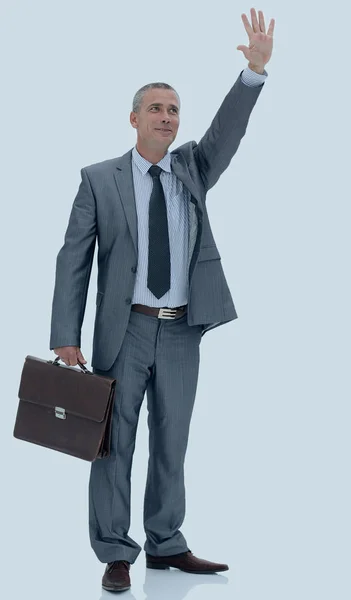 Уверенный в себе бизнесмен делает приветственный жест рукой — стоковое фото