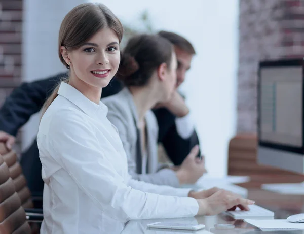 Employees working on personal computers with financial data — Stock Photo, Image