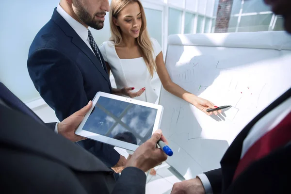 Close up.business partners discussing a new design project — Stock Photo, Image