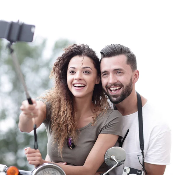 Male and female on motor scooters in a town. — Stock Photo, Image