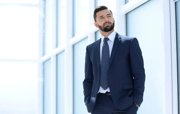 Dreaming of a businessman standing in new office — Stock Photo, Image