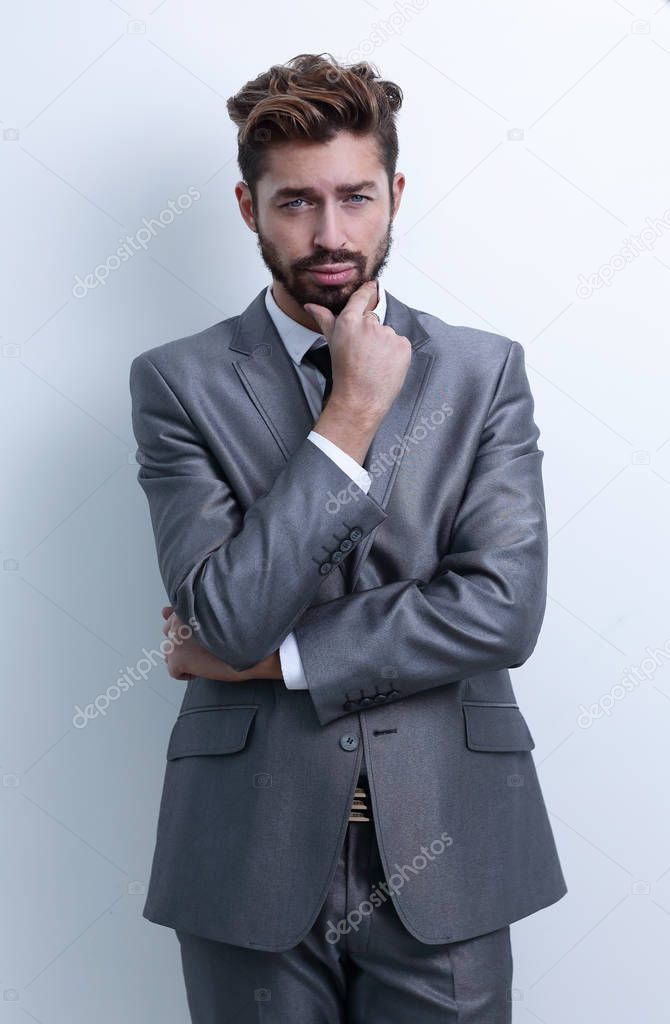 young businessman posing with crossed arms.