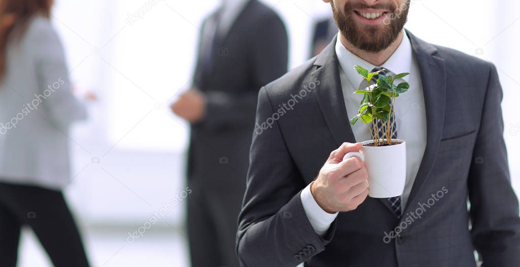 businessman with green young escape on blurred background