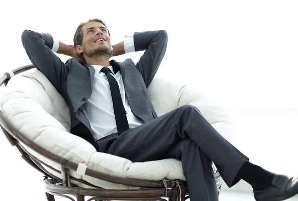 Joven hombre de negocios meditando en gran sillón cómodo —  Fotos de Stock