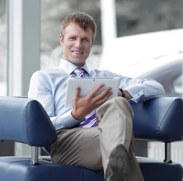 Businessman in suit resting in armchair at office — Stock Photo, Image