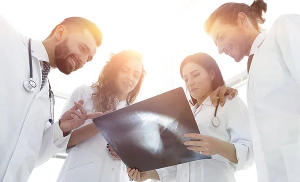 group of doctors discussing an x-ray