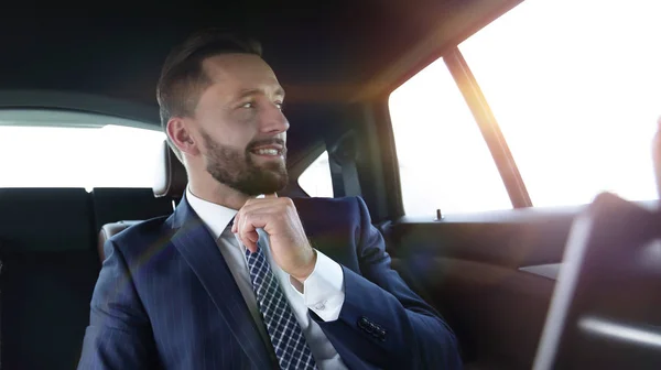 Confident businessman sitting in car — Stock Photo, Image