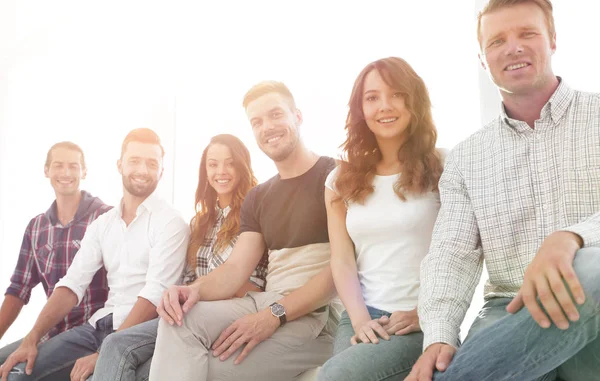 Young creative people sitting on chairs in waiting room — Stock Photo, Image